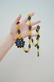 1930s Yellow celluloid and carved blue Galalith belt/necklace